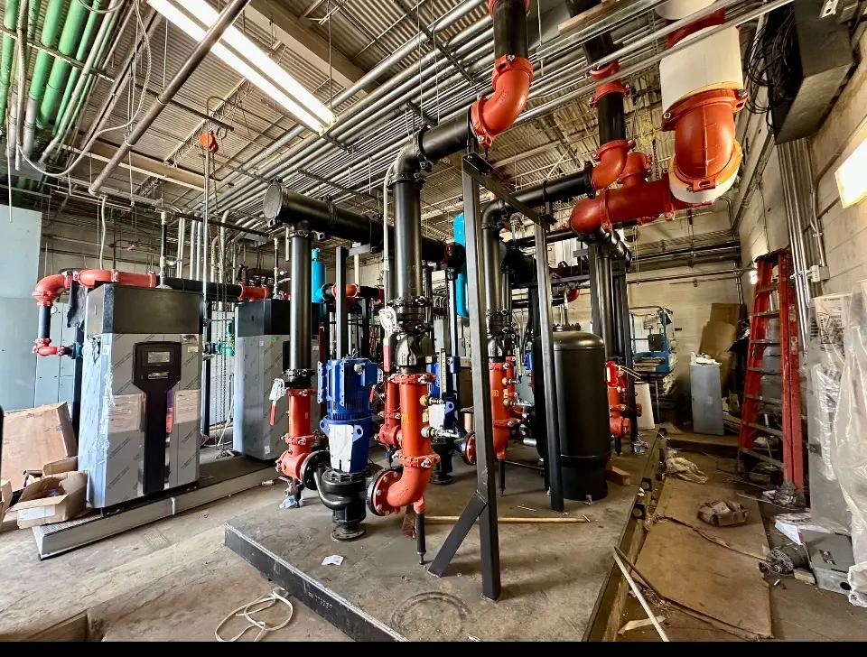 Completed mechanical room piping and equipment connections